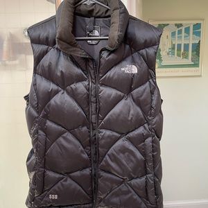 The North Face Black puffy vest. Very warm size large. Like new